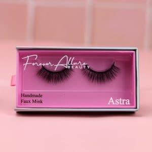 An image of our Astra lashes on a pink background