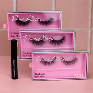Triple magnetic eyelash kit pictured with 3 cases open on a pink background